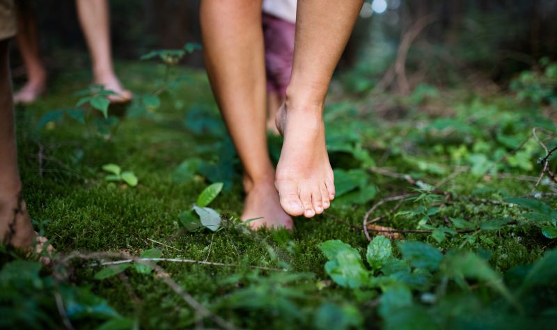 Did you know there's health benefits to walking barefoot in the grass?
